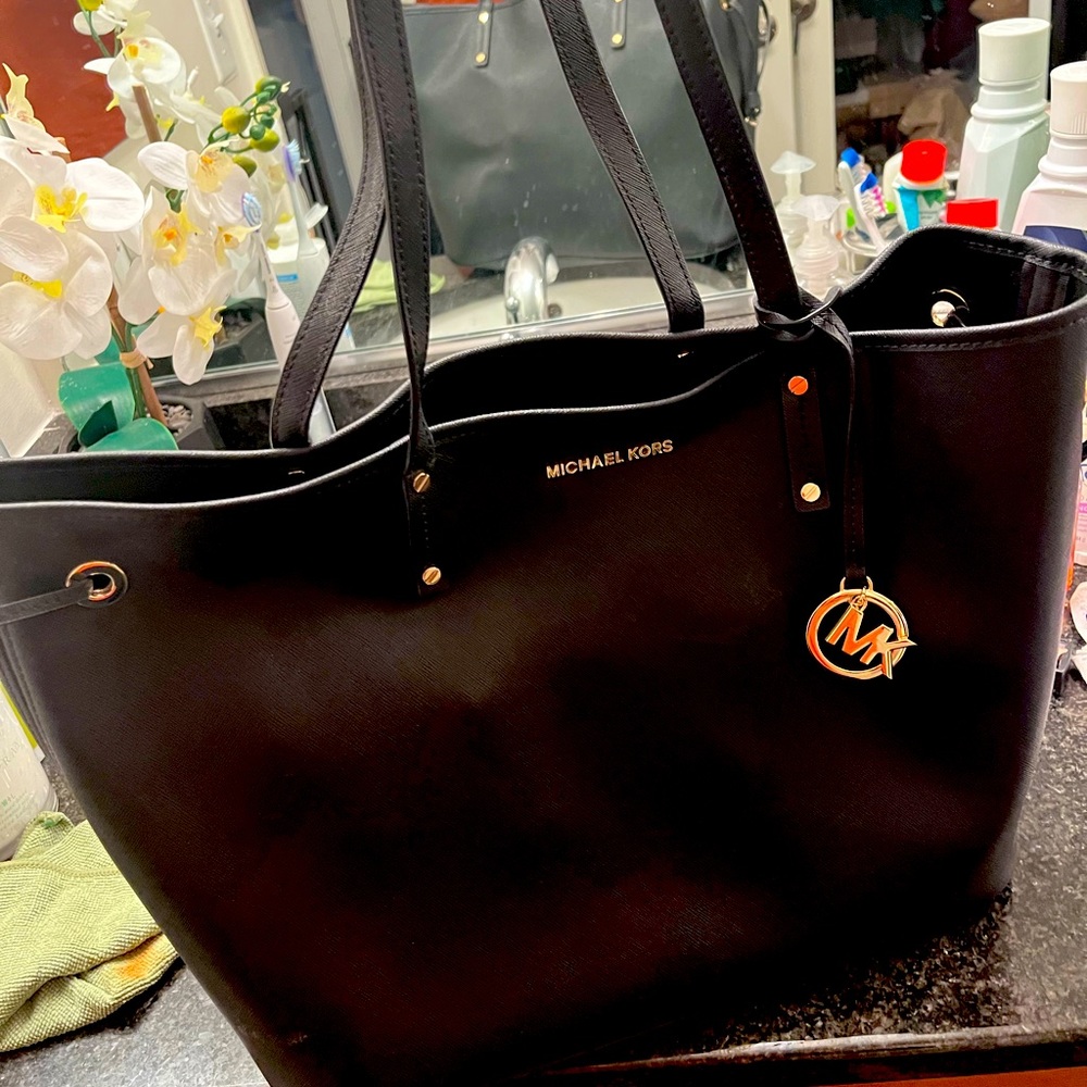Beautiful large tote. Great shape inside and out with minor fraying on handles